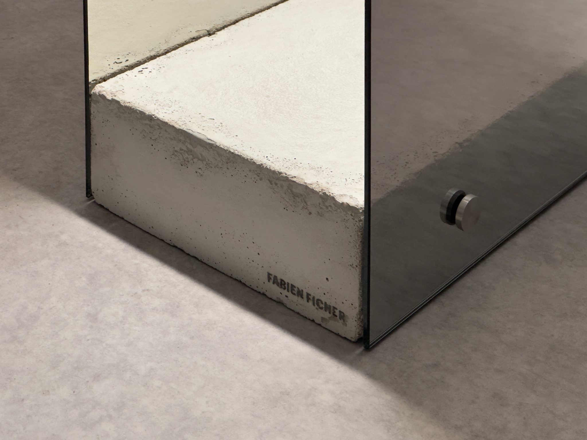 Raw concrete block signed by the artist Fabien Ficher, holding two tinted glass plates.