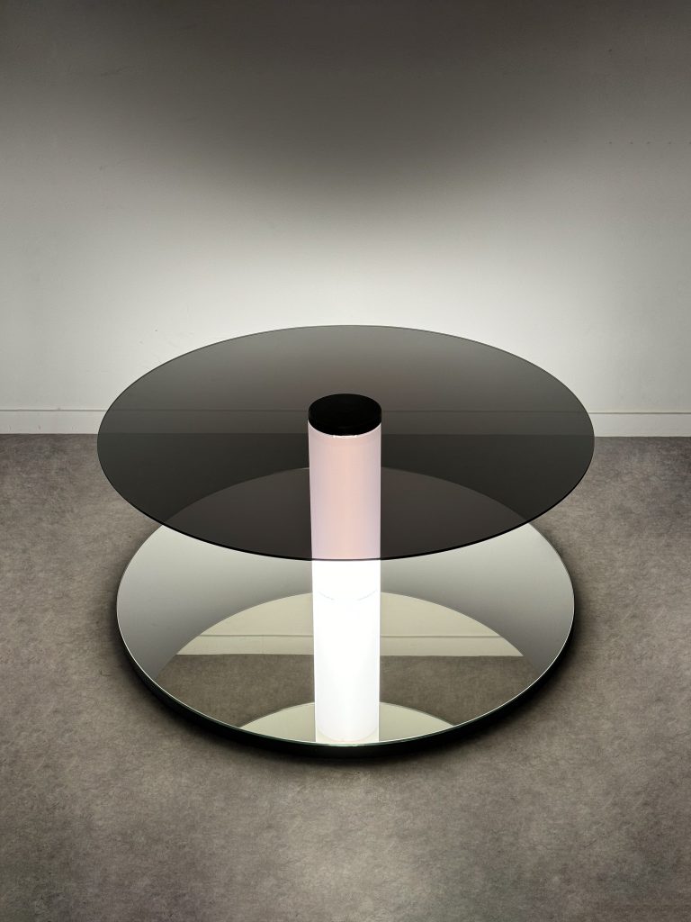 Minimalist floor sculpture "Graduate Flatfoot" made of glass, steel, and a luminous tube creating an infinite perspective.