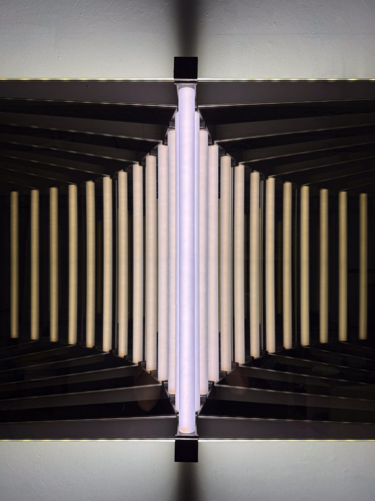 Close-up of “Duality” highlighting the symmetrical interplay of steel, glass, and light.