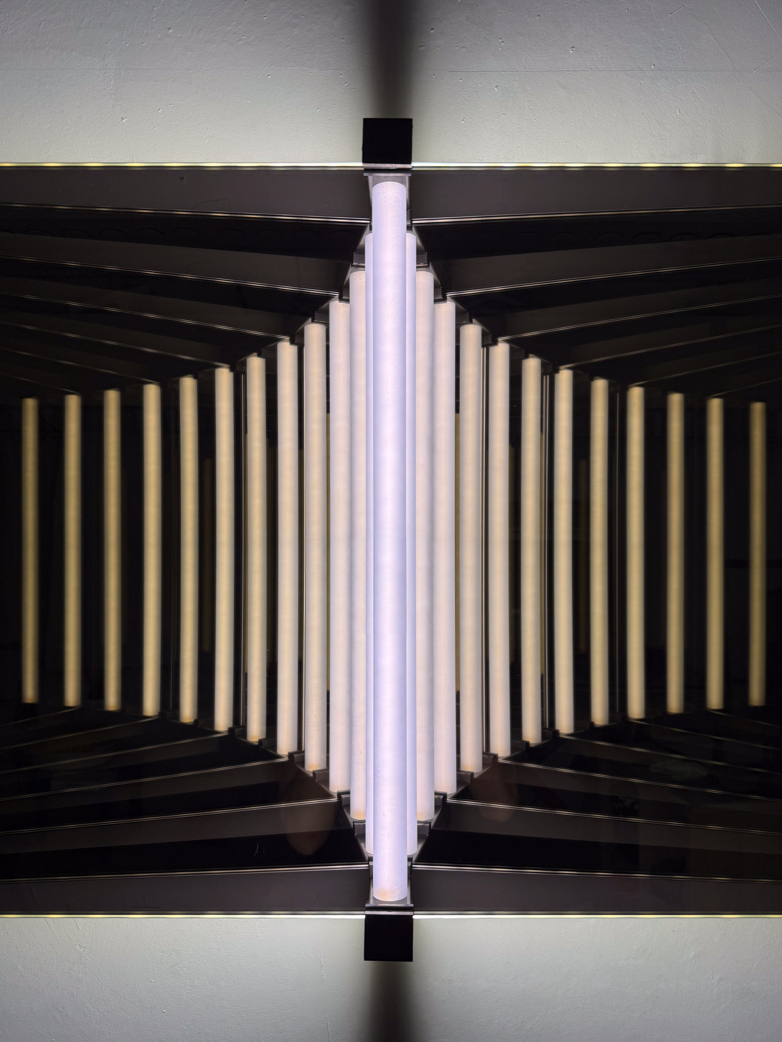 Close-up of “Duality” highlighting the symmetrical interplay of steel, glass, and light.
